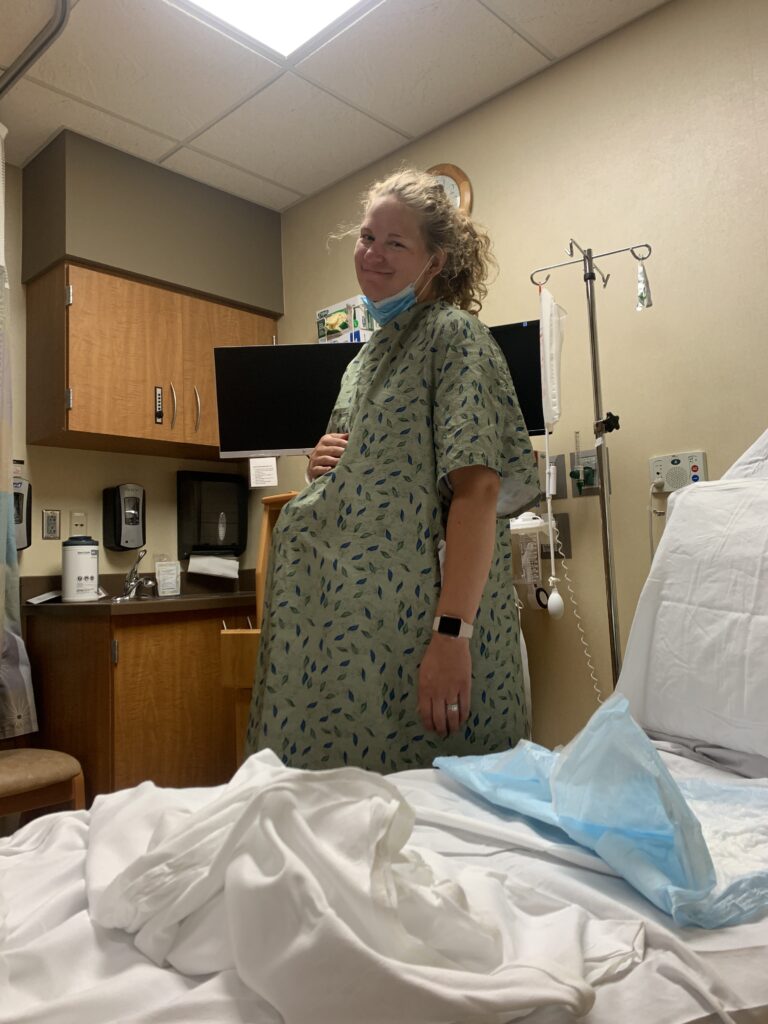 first time mom standing in triage hospital room